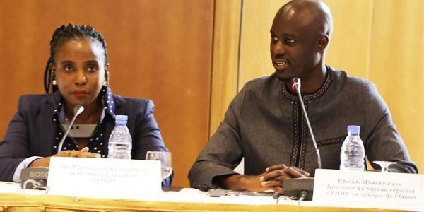 African Population Health Research Center Executive Director Catherine Kyobutungi with Dr Cheik Faye Wits alumnus and CARTA Fellow at the launch and his appointment as director of the APHRC West Africa region May 2019